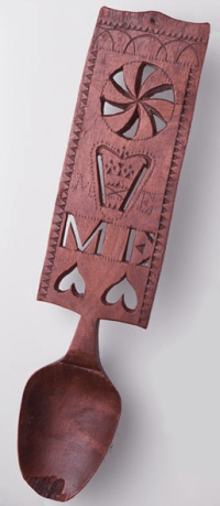 carved wooden love spoon