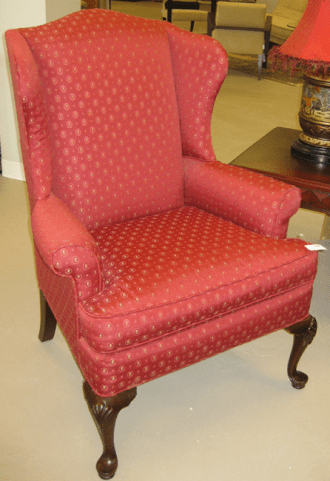 wing chair upholstered in red